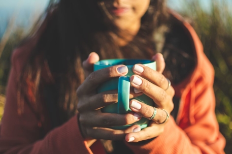 Woman holding coffee