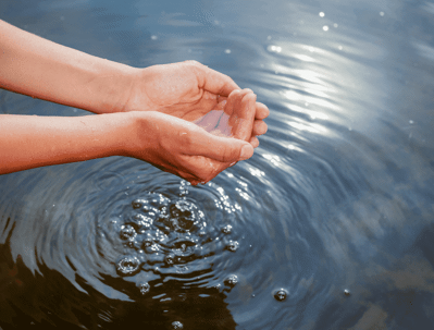 Scooping water with hands