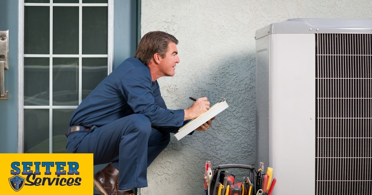 HVAC technician performing maintenance on AC unit.